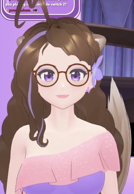 Animated female avatar with glasses, purple eyes, floral hair accessory, wearing pink dress