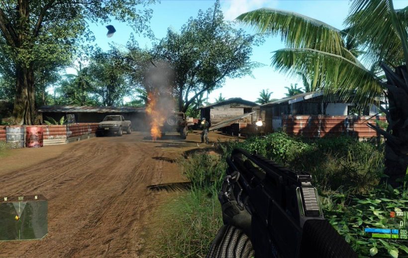 First-person view of a soldier holding a rifle in a burning village combat scene