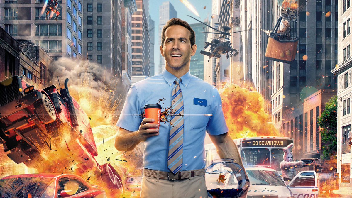 Smiling man in blue shirt holding coffee and fishbowl amid city explosions