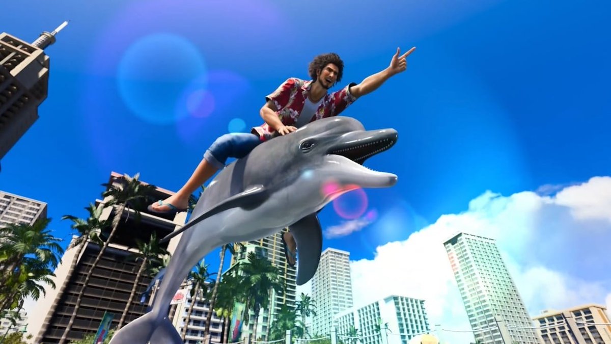 Man in Hawaiian shirt joyfully riding a large dolphin statue above cityscape.
