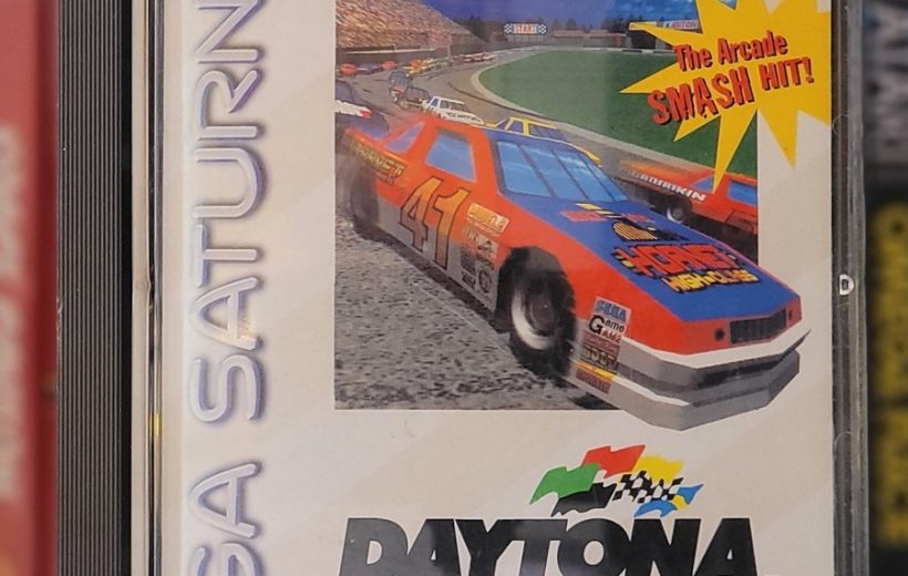 Sega Saturn game case for Daytona USA featuring a red stock car racing graphic