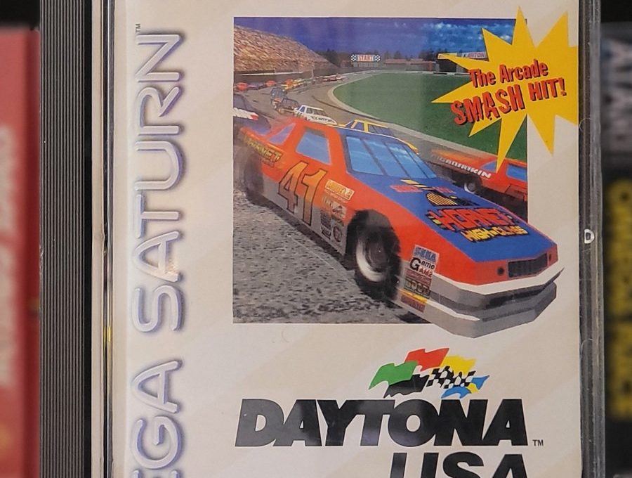 Sega Saturn game case for Daytona USA featuring a red stock car racing graphic