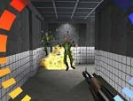 Player-held shotgun firing at a green alien in a sci-fi corridor explosion